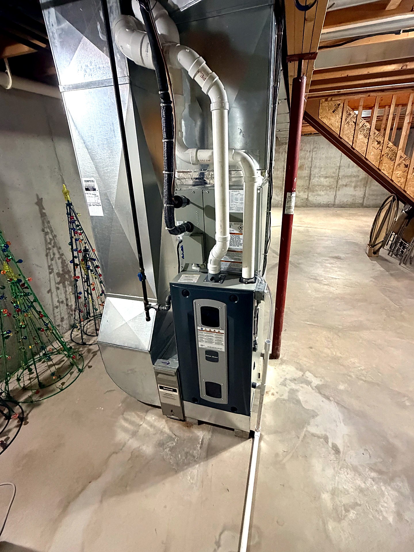 Complete American Standard heating system with furnace, evaporator coil, and air filter cabinet